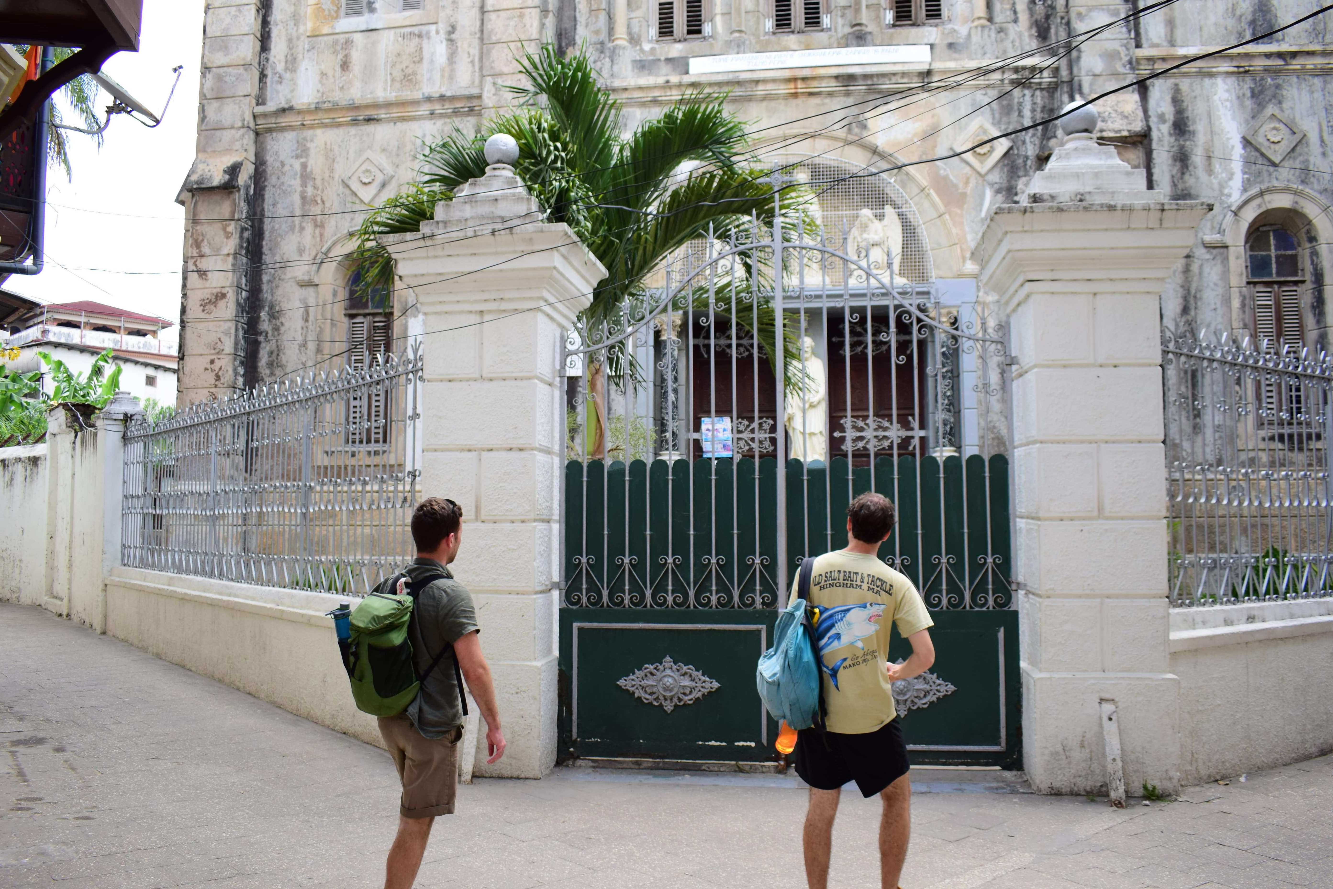 Tourist walking looking at The St. Joseph's Cathedral, Zanzibar