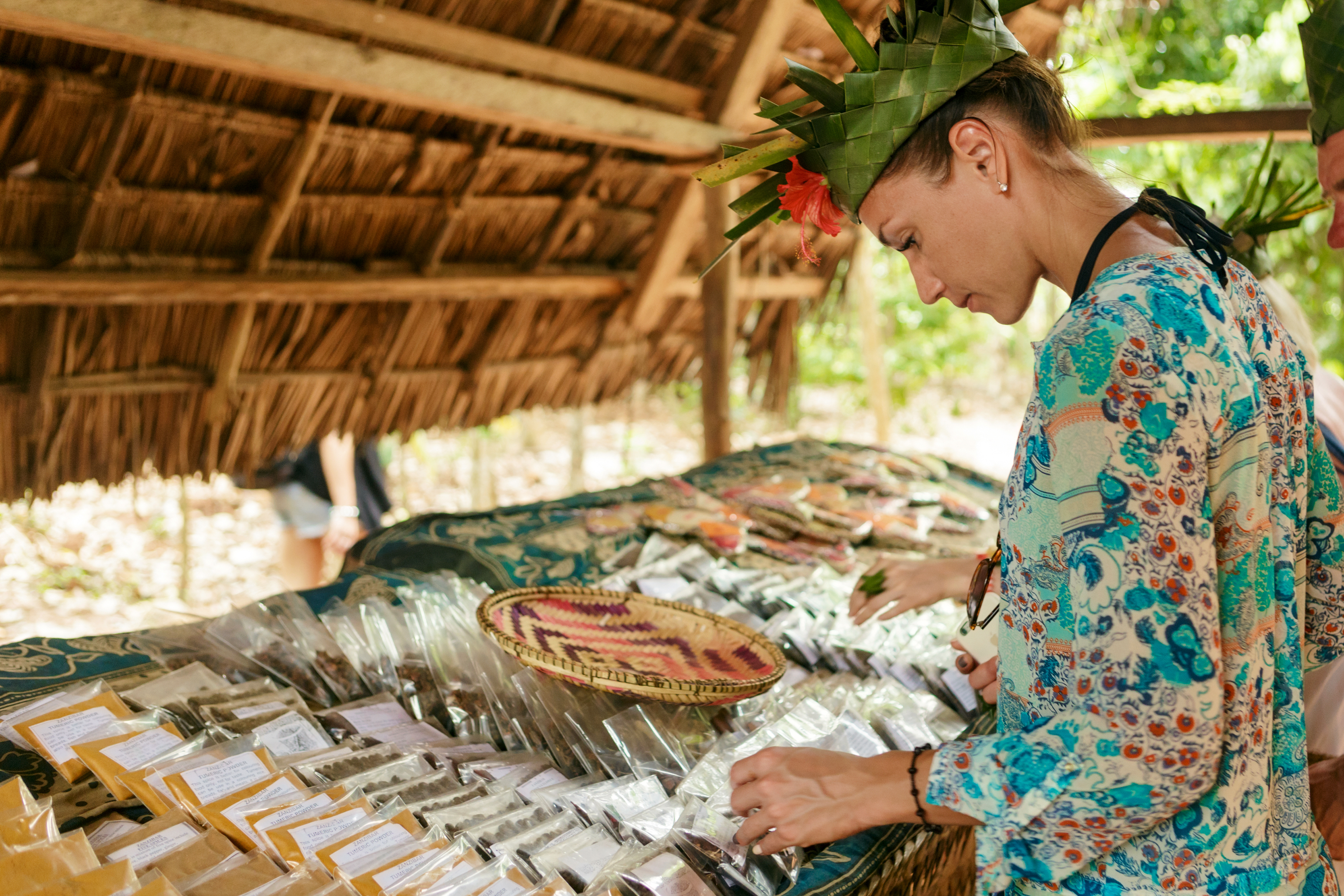 Tourist looking at spices during zanzibar spice farm